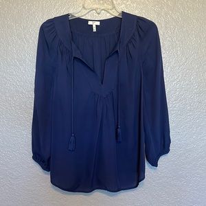 Deep navy blue Joie blouse with deep v-neck cut.